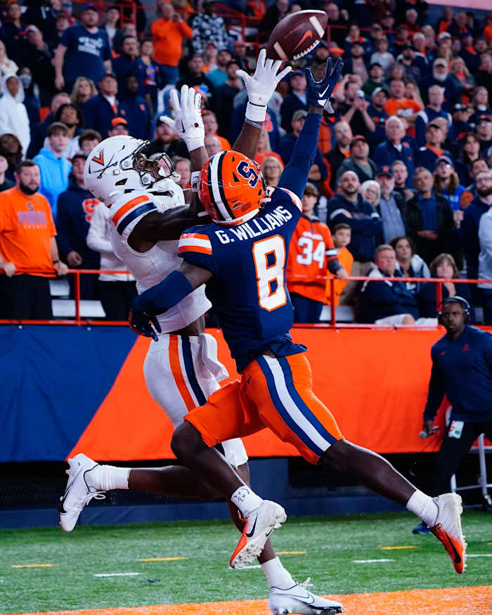 Syracuse Orange defensive back Garrett Williams (8) breaks up a pass intended for Virginia Cavaliers receiver Lavel Davis Jr. (1). Mandatory Credit: Gregory Fisher-USA TODAY Sports